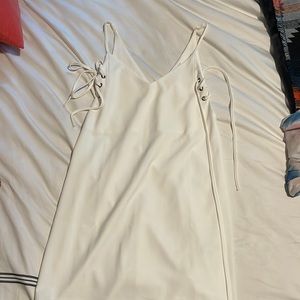 White Sleeveless dress with laced up sides. Size Medium. Only worn once.